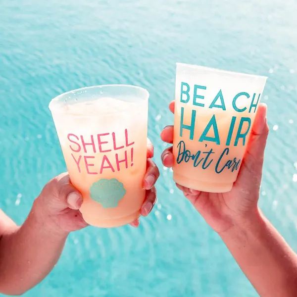 a woman holding a cup of water