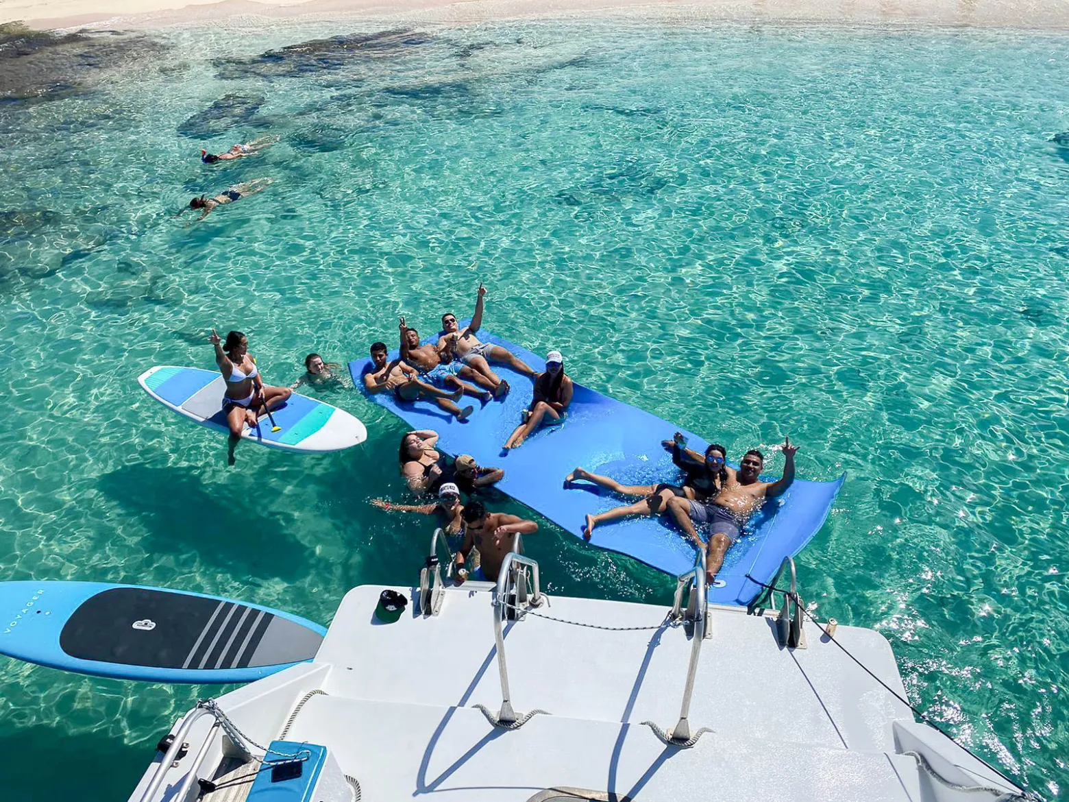 a group of people swimming in the water