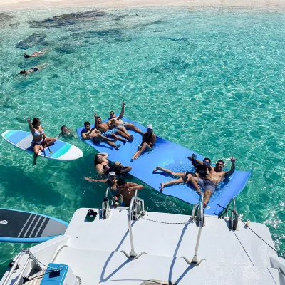 a group of people swimming in the water